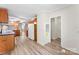 Hallway with wooden cabinets, neutral walls, and vinyl flooring at 1055 Cedar Hill Dr, Rockwell, NC 28138