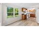 Bright kitchen featuring white appliances and modern vinyl flooring at 1055 Cedar Hill Dr, Rockwell, NC 28138