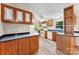 Kitchen with wooden cabinets, blue counters, and vinyl flooring at 1055 Cedar Hill Dr, Rockwell, NC 28138