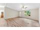 Cozy living room offers new wood-look flooring and a ceiling fan for year-round comfort at 1055 Cedar Hill Dr, Rockwell, NC 28138
