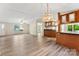 Open-concept living area with neutral walls, ample light, and vinyl flooring at 1055 Cedar Hill Dr, Rockwell, NC 28138