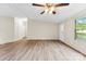 Living room features new wood-look floors, neutral paint, and a ceiling fan for added comfort at 1055 Cedar Hill Dr, Rockwell, NC 28138