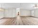 The spacious living room includes wood-look flooring, neutral walls, and a front door at 1055 Cedar Hill Dr, Rockwell, NC 28138