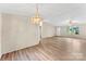 Bright and airy living room featuring light walls and modern vinyl floors at 1055 Cedar Hill Dr, Rockwell, NC 28138