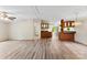 Living room featuring updated flooring and open access to kitchen bar with overhead cabinets at 1055 Cedar Hill Dr, Rockwell, NC 28138