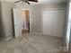 Bedroom with carpeted floors and closet at 11622 Lioness St, Charlotte, NC 28273