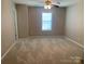 Bedroom with carpeting and a ceiling fan at 11622 Lioness St, Charlotte, NC 28273