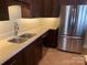 Updated kitchen features stainless steel appliances, a double sink, and dark wood cabinets at 11622 Lioness St, Charlotte, NC 28273