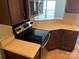 Beautiful kitchen showcasing modern electric range and counter seating at 11622 Lioness St, Charlotte, NC 28273