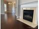 Bright living space with hardwood floors, fireplace, and view into dining room at 11622 Lioness St, Charlotte, NC 28273
