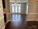 Spacious living room filled with natural light from the large windows and doors at 11622 Lioness St, Charlotte, NC 28273