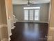 Bright living room with hardwood floors and French doors leading to outdoor space at 11622 Lioness St, Charlotte, NC 28273
