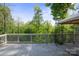 View of the home's back deck, with a wooden floor and a metal gazebo at 1175 Valley St # 111, Statesville, NC 28677