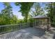 The house's back deck features a gazebo with an outdoor view framed by mature trees at 1175 Valley St # 111, Statesville, NC 28677