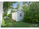 Backyard shed with light-blue siding, double doors, and a window at 1175 Valley St # 111, Statesville, NC 28677