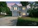 Charming two-story home with landscaped yard, attached garage, and inviting front entrance at 1175 Valley St # 111, Statesville, NC 28677