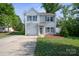 Charming two-story home with landscaped yard, attached garage, and inviting front entrance at 1175 Valley St # 111, Statesville, NC 28677