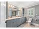 Bathroom featuring double sinks, granite countertops, updated cabinets, and glass shower at 12048 Royal Portrush Dr, Charlotte, NC 28277