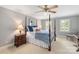 Bedroom with four poster bed, ceiling fan, and carpeted floor at 12048 Royal Portrush Dr, Charlotte, NC 28277