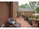 Expansive brick patio with outdoor seating, perfect for entertaining or enjoying a quiet moment at 12048 Royal Portrush Dr, Charlotte, NC 28277