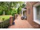 Spacious brick patio with comfortable seating, offering a relaxing outdoor space at 12048 Royal Portrush Dr, Charlotte, NC 28277