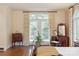 Bright bedroom featuring a vanity, french doors, and shuttered windows at 12048 Royal Portrush Dr, Charlotte, NC 28277