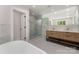 Elegant bathroom with glass shower, soaking tub, and modern double vanity at 1208 Tarrington Ave, Charlotte, NC 28205