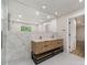 Bright bathroom with a double sink vanity, a large mirror, and modern finishes at 1208 Tarrington Ave, Charlotte, NC 28205