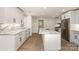 Modern kitchen features an island, stainless steel appliances, and ample counter space at 1208 Tarrington Ave, Charlotte, NC 28205