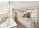 Bright, open kitchen featuring marble countertops, stainless steel appliances, and an island at 1208 Tarrington Ave, Charlotte, NC 28205