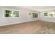 Bright living space with large windows, hardwood floors, and modern trim at 1208 Tarrington Ave, Charlotte, NC 28205