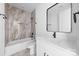 Bathroom featuring tile, a shower-tub, vanity, and black hardware at 13109 Homewood Dr, Charlotte, NC 28262