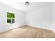 Empty bedroom features hardwood floors and a window with a green view at 13109 Homewood Dr, Charlotte, NC 28262