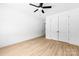 Bedroom with hardwood floors, ceiling fan and large closet doors at 13109 Homewood Dr, Charlotte, NC 28262