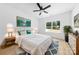 Bright bedroom with a large window, hardwood floors, stylish decor, and ample natural light at 13109 Homewood Dr, Charlotte, NC 28262