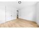 Bedroom featuring hardwood floors, double closets, and an open door at 13109 Homewood Dr, Charlotte, NC 28262