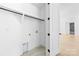 Walk-in closet with hanging rack and visible plumbing hookups and connections at 13109 Homewood Dr, Charlotte, NC 28262