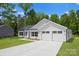 This new home offers a large driveway, 2-car garage, landscaped front yard, and classic white siding at 13109 Homewood Dr, Charlotte, NC 28262