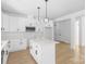 Bright kitchen with central island, stainless appliances, and ample storage space at 13109 Homewood Dr, Charlotte, NC 28262