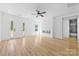 Bright living room boasts modern fireplace, ceiling fan, and stylish floors at 13109 Homewood Dr, Charlotte, NC 28262