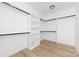 Organized walk-in closet features shelving and hanging racks for storage solutions at 13109 Homewood Dr, Charlotte, NC 28262