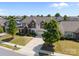 An aerial view showing a well-manicured lawn, mature trees, and a neighborhood setting at 13315 Hunting Birds Ln, Charlotte, NC 28278