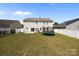 View of a backyard with a trampoline, small shed, and fence, creating a private space at 13315 Hunting Birds Ln, Charlotte, NC 28278