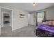 Bedroom with carpet flooring, and a large window providing ample natural light at 13315 Hunting Birds Ln, Charlotte, NC 28278