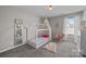 Charming bedroom with a whimsical tented bed, soft rug, and plenty of room for play at 13315 Hunting Birds Ln, Charlotte, NC 28278