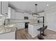 Bright kitchen features granite countertops, island with breakfast bar, and stainless steel appliances at 13315 Hunting Birds Ln, Charlotte, NC 28278