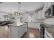 Modern eat-in kitchen features granite countertops, stainless steel appliances, and breakfast area at 13315 Hunting Birds Ln, Charlotte, NC 28278