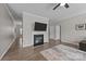 Cozy living area with a fireplace, hardwood floors, and a neutral color palette at 13315 Hunting Birds Ln, Charlotte, NC 28278