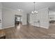 Bright, open-concept living room features hardwood floors and offers versatile space for office and living at 13315 Hunting Birds Ln, Charlotte, NC 28278