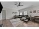 Comfortable living area with a modern sectional, stylish rug, and natural light at 13315 Hunting Birds Ln, Charlotte, NC 28278
